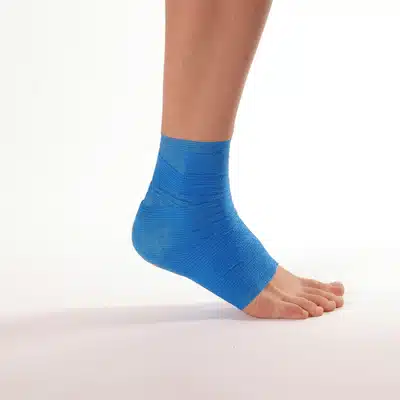 Photo shows blue elastic ankle wrap on foot, supporting ankle fracture in dallas recovery process