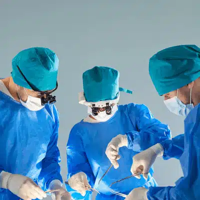 Surgical team operates in sterile theater, performing repair for rotator cuff tear dallas patient today