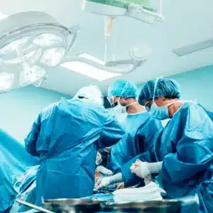 Surgeons operate under bright lights, a key step before applying shoulder surgery recovery tips